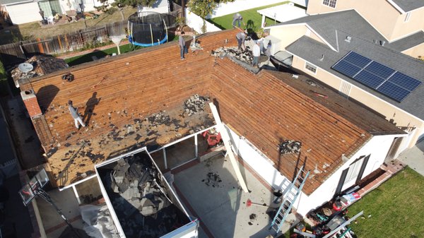 Re-roof in Huntington Beach - This is a re-roof we did in Huntington Beach where we tore off the existing roof and installed new plywood over the entire roof deck. Then we installed new Owens Corning Deck Defense and new Owens Corning Woodcrest Carbon Shingles. Re-roof in Huntington Beach - This is a re-roof we did in Huntington Beach where we tore off the existing roof and installed new plywood over the entire roof deck. Then we installed new Owens Corning Deck Defense and new Owens Corning Woodcrest Carbon Shingles.