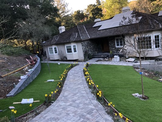 Pavers and artificial turf installation - This remodel was done on pavers, artificial turf, and the retaining wall. The owner can now enjoy her front yard. She was very satisfied with the work we did! Pavers and artificial turf installation - This remodel was done on pavers, artificial turf, and the retaining wall. The owner can now enjoy her front yard. She was very satisfied with the work we did!