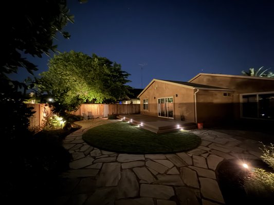 San Jose, CA - This custom design was fully completed in 1.5 months. New driveway of belgard pavers, Timbertech deck, new sod and irrigation system for plants, flatstone design, new fence surrounding perimeter and as you can see beautiful lighting system to elevate the night time in the backyard. San Jose, CA - This custom design was fully completed in 1.5 months. New driveway of belgard pavers, Timbertech deck, new sod and irrigation system for plants, flatstone design, new fence surrounding perimeter and as you can see beautiful lighting system to elevate the night time in the backyard.