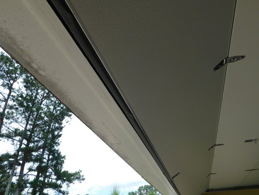 Steel-backed Garage Door Installation - A sleek, long panel (Ranch) garage door designs makes for a "less busy" looking garage door design. The steel-backed construction allows for a more durable garage door, reflected by the LIFTETIME panel guarantee.