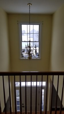 Chandelier Installation - Customer was looking to get a new chandelier installed in their entryway. This modern spiral chandelier looks amazing in this space!