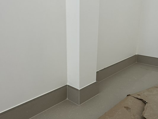 Install tile baseboards - Tile baseboard installation — precision 45-degree cuts, installation of tile baseboards, grouting, and silicone sealing along the wall for a clean, finished edge. Install tile baseboards - Tile baseboard installation — precision 45-degree cuts, installation of tile baseboards, grouting, and silicone sealing along the wall for a clean, finished edge.