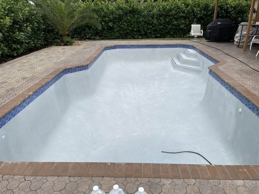 Pool Remodel - This pool was looking terrible and in need of a serious facelift. So we stripped the tile and surface down and installed a new glass tile and replastered the pool with Diamond Brite
