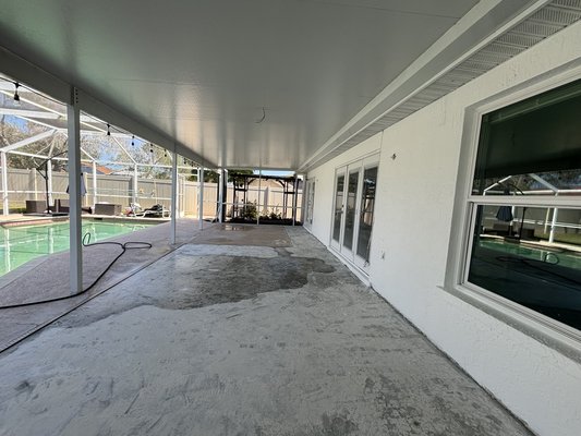 POOLSIDE TERRACE (FLOOR) - We upgraded the poolside terrace with new, durable flooring designed to withstand the elements while enhancing the outdoor living experience.