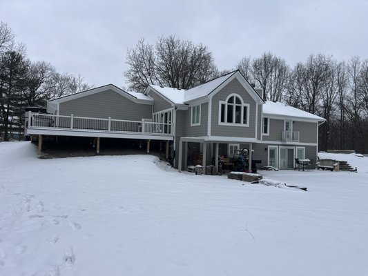 Who says you have to wait for spring to build your dream deck? ❄️ - This stunning deck in Trex Foggy Wharf decking boards with white fascia, white railing, and black balusters was completed in the heart of winter, proving that with our innovative techniques, we can build year-round!

With access to two doors, this deck offers seamless functionality and design. By building now, the homeowners are ready to enjoy their new outdoor space at the very first sign of warm weather. No delays, no waiting—just pure enjoyment when spring arrives. 🌷

Don’t wait to start your deck project! Let’s create your perfect outdoor retreat—winter, spring, summer, or fall.
