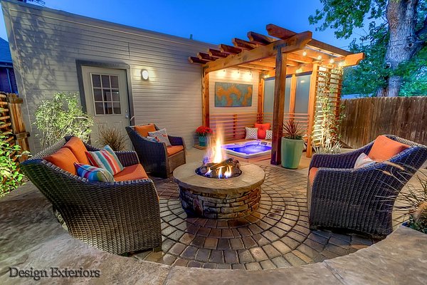 The Caldwell/Guidroz Residence - The Caldwell/Guidroz family turned to Design Exteriors to help them create a hideaway for them away from the stresses of the everyday world that would also function as an entertainment area for visiting friends and family. The result is this versatile courtyard tempered with private decorative fencing and lighting to give the space an almost sacred calm.
Scope of Project: Sunken hot tub, pergola, cedar and glass privacy screen, cedar trellis, fire pit, seat wall, paver and sand-finished concrete patio, landscape lighting, underground utilities, irrigation, automatic flower pot irrigation, plantings and drainage and sump system. The Caldwell/Guidroz Residence - The Caldwell/Guidroz family turned to Design Exteriors to help them create a hideaway for them away from the stresses of the everyday world that would also function as an entertainment area for visiting friends and family. The result is this versatile courtyard tempered with private decorative fencing and lighting to give the space an almost sacred calm.
Scope of Project: Sunken hot tub, pergola, cedar and glass privacy screen, cedar trellis, fire pit, seat wall, paver and sand-finished concrete patio, landscape lighting, underground utilities, irrigation, automatic flower pot irrigation, plantings and drainage and sump system.