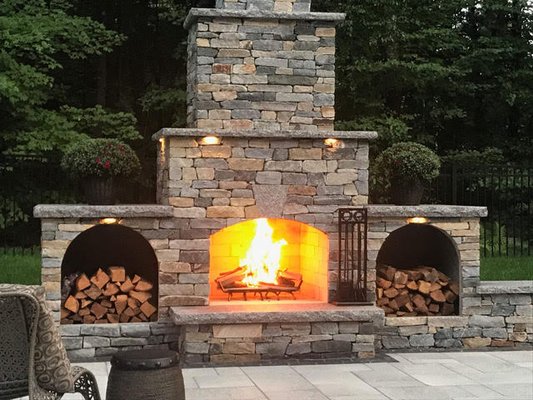 Fireplace Installation - A classic mainstay of an outdoor space is the fire pit. Many of us have spent fond evenings relaxing around the fire as the heat of the day dissipates. The traditional fire pit has come a long way over the years and can be customized to match your outdoor kitchen. Another development is taking the traditional fireplace from inside the home and placing it outside. Fireplace Installation - A classic mainstay of an outdoor space is the fire pit. Many of us have spent fond evenings relaxing around the fire as the heat of the day dissipates. The traditional fire pit has come a long way over the years and can be customized to match your outdoor kitchen. Another development is taking the traditional fireplace from inside the home and placing it outside.