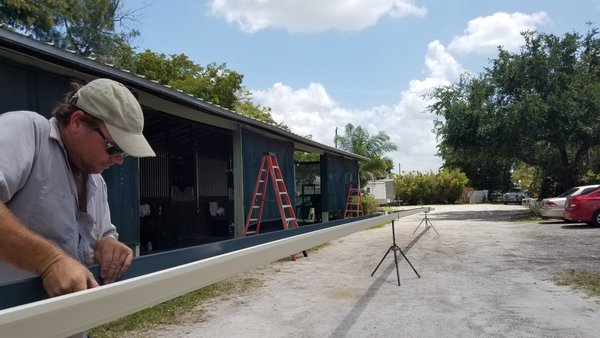 Gutter Installation on a horse barn - Glen installed on a barn in Wellington. We love doing these types of installs! The horses are always appreciative.