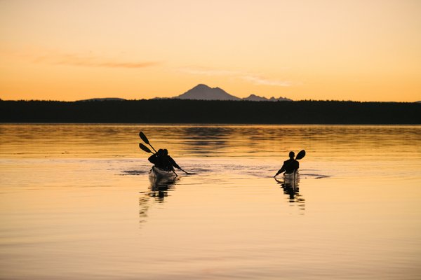 Sunset Kayak Tours - There is almost no better time to be on the water than paddling at sunset. As it gets late in the day most of the boat traffic has headed to port and we have the place to ourselves. Many companies will paddle the east side for sunset but we all know the sun sets in the west. So we plan our route along the west side of San Juan to provide the best sunset kayak experience possible. If you are looking for a few stunning photos for your vacation then this is the kayak tour for you. 

We operate with small group sizes to ensure you can easily communicate with your kayak guide, reduce our impact on beaches and wildlife, and the overall safety of the groups. Our goal is to provide experiences, not cattle drives.