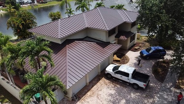 Metal Roof Installation - We recently completed a stunning metal roof installation for a residential client in Coral Gables, FL. Our team expertly removed the old roof and installed a sleek, modern metal roof, providing enhanced durability and energy efficiency. The new roof not only boosts the home's curb appeal but also ensures long-lasting protection against Florida's weather conditions. The client is thrilled with the results, praising our attention to detail and the high-quality craftsmanship that BluePanther Roofing is known fo