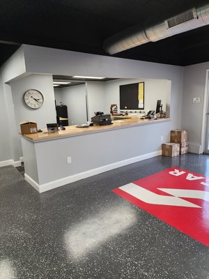 Socar Chemical Remodel - We always love the opportunity to remodel local businesses. Socar Chemicals was no exception. They opened for business in 1967, and the building was in need of some major upgrades. We gutted the entire showroom and all of the office spaces. We replaced all the insulation and swapped the dated wall paneling with drywall. The showroom needed to feel more spacious, so we decided to remove the drop ceilings and open up the room's vertical space. All new aluminum duct work was installed, along with new lighting and electrical. The carpet in the showroom was a must-go. So we stripped it all, revealing the original concrete pad. To compliment the industrial style of the space, we refinished the concrete surface and layered it with epoxy and color chips. We installed all new wall display shelving and a beautiful acacia butcher-block sales countertop. The showroom bathroom was also completely remodeled, with brand new fixtures and plumbing. The office spaces got fresh paint, and all new trim. We removed the dilapidated laminate flooring and installed carpet tiles for a cozier feel to the space. This project was extensive but incredibly rewarding. We always look forward to any opportunities to help service local businesses! Socar Chemical Remodel - We always love the opportunity to remodel local businesses. Socar Chemicals was no exception. They opened for business in 1967, and the building was in need of some major upgrades. We gutted the entire showroom and all of the office spaces. We replaced all the insulation and swapped the dated wall paneling with drywall. The showroom needed to feel more spacious, so we decided to remove the drop ceilings and open up the room's vertical space. All new aluminum duct work was installed, along with new lighting and electrical. The carpet in the showroom was a must-go. So we stripped it all, revealing the original concrete pad. To compliment the industrial style of the space, we refinished the concrete surface and layered it with epoxy and color chips. We installed all new wall display shelving and a beautiful acacia butcher-block sales countertop. The showroom bathroom was also completely remodeled, with brand new fixtures and plumbing. The office spaces got fresh paint, and all new trim. We removed the dilapidated laminate flooring and installed carpet tiles for a cozier feel to the space. This project was extensive but incredibly rewarding. We always look forward to any opportunities to help service local businesses!