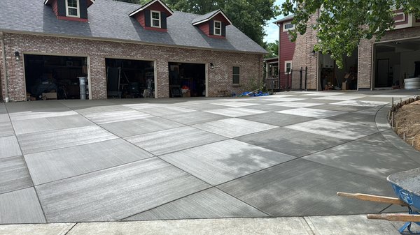 We did a new driveway in Firestone - We replaced an old driveway, upgraded it to a heated driveway with lighting, added 4” of road base, and properly compacted it.  We reinforced it with half-inch rebar with 3’ on center and wire mesh. Poured a 6” thick slab with 4,500 PSI and fiber mesh.