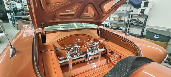1958 impala custom trunk build - Custom trunk build to hide wires, metal frame and batteries. Our client had a vision and we worked with him to bring his vision to life.  
we built side panels with access points for serviceability, trunk top with mirror frames, acrylic logos, upholstered with vinyl, suede to color match interior. Full control RGB lighting 

What's your vision!?