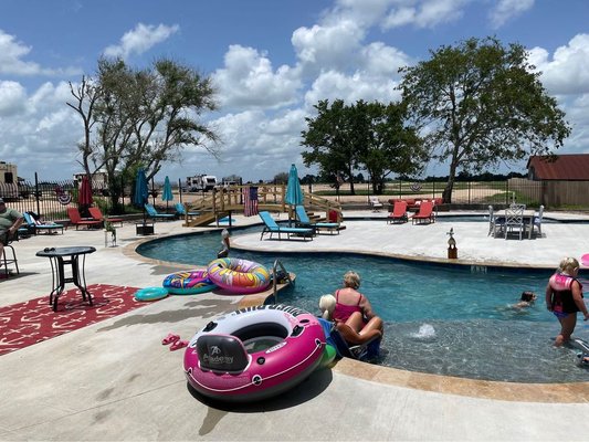 Lazy River - Iron Horse RV Resort has a Lazy River and a Pool with a Hot Tub. Come relax and float the Lazy River and enjoy a cook out at the event area or play games in the Game Room. Bring your fishing pole and enjoy the fishing pond, or bring your Golf Cart and enjoy the 54 acres. Full restrooms and laundry room. Large RV Sites and Buddy Sites.. Bring your own Coolers to the Pools