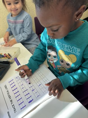 Toddlers practice writing - Toddlers practice writing during circle time. Toddlers practice writing - Toddlers practice writing during circle time.