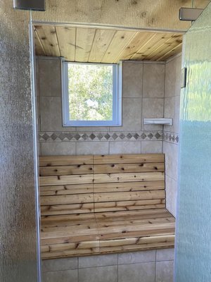 MrSteam Bathroom Conversion - We completed a full steam shower conversion for our client using a MrSteam system. Our team sectioned off part of the existing shower, relocated the showerhead, added custom glass, a cedar bench, and a wood-paneled ceiling. The new enclosure is fully sealed for optimal steam performance—allowing the homeowner to enjoy the full health and relaxation benefits of a steam room. MrSteam Bathroom Conversion - We completed a full steam shower conversion for our client using a MrSteam system. Our team sectioned off part of the existing shower, relocated the showerhead, added custom glass, a cedar bench, and a wood-paneled ceiling. The new enclosure is fully sealed for optimal steam performance—allowing the homeowner to enjoy the full health and relaxation benefits of a steam room.