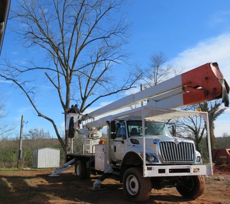 Tree over home, building, and near power lines - This tree was over a house, over a building, and near power lines. It was tricky but we knew exactly how to do this. Owner was amazed that every limb fell where we said it would. No damage to the house, building, or power lines. Owner was extremely pleased with the clean up. Tree over home, building, and near power lines - This tree was over a house, over a building, and near power lines. It was tricky but we knew exactly how to do this. Owner was amazed that every limb fell where we said it would. No damage to the house, building, or power lines. Owner was extremely pleased with the clean up.
