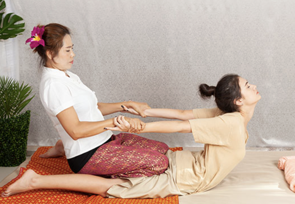 Thai Massage - Thai massage or Thai yoga massage is a traditional therapy combining acupressure, Indian Ayurvedic principles, and assisted yoga postures. The idea of Shen-lines alias energy-lines was first used as "Thai yoga massage"
