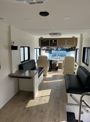 Mobile Health Clinic Conversion - We took this bus down to a blank slate, designed and constructed an entire layout to meet our customers needs, updated appliances and lighting, and finished it out with trim and paint.