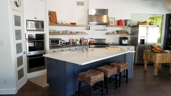 New Build Floating Shelves & Cabinet Refacing - This kitchen refacing project replaced their existing upper cabinets with custom new build alder floating shelves, white shaker door lower cabinets, and hale navy blue island facade. We also designed, built, and installed a custom built-in corner cabinet in the breakfast nook