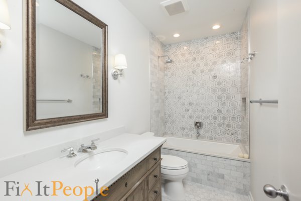 Lakeview Bathroom - How we wish we had before pictures! The layout of this bathroom was a little funky. We were hired to do a full gut, reconfigure the design and rework the plumbing, electrical and mechanicals. We then partnered with a designer to deliver our clients their dream bathroom. Notice the location of the shower faucet - we live for these details.
