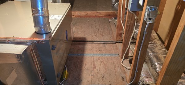 Carrier Two-Stage Furnace Replacement – San Mateo - Attic furnace replacement in San Mateo. We removed the old furnace and installed a new Carrier two-stage gas furnace while keeping the existing AC and duct system.

The existing evaporator coil drain was not installed correctly. It did not have a proper P-trap or service port and the drain line needed better slope and support for reliable condensate flow. We rebuilt the drain connection, installed a new P-trap with service access and corrected the drain slope.

We also replaced the old auxiliary drain pan under the evaporator coil and installed an emergency float safety switch to shut the system down if water collects in the pan.

The installation also included new furnace exhaust venting, gas sediment trap, furnace fusible service switch and armored electrical connection.

System tested and prepared for HERS/ECC verification and city inspection.