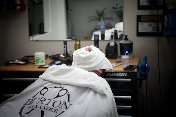 Hot lather shave - Our Service begins with manicuring and shaping of your beard to achieve the desired look. Next a mustache trim to compliment the beard. We finish off with a hot towel straight razor outline and neck shave followed with beard oil and a scented steam towel for comfort.