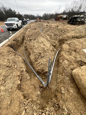 Commercial electrical services - On this job we installed 14 light poles and installed 200ft of 2” electrical conduit! Commercial electrical services - On this job we installed 14 light poles and installed 200ft of 2” electrical conduit!