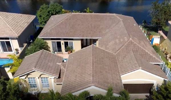 Tile Roofing - A beautiful house in need of a new roof to make it shine. To get it it back to where it needed to be we have to do a few steps. 1. We pulled the roof off down to the wooden decking replace any rotting wood we find. 2. We replace the Felting Paper to the roof to prevent water leaks. 3. we start adding the Peel and Stick to prepare for the tiles. 4. Finally we add the tiles using a foam seal to make them stick through hurricane force winds. Tile Roofing - A beautiful house in need of a new roof to make it shine. To get it it back to where it needed to be we have to do a few steps. 1. We pulled the roof off down to the wooden decking replace any rotting wood we find. 2. We replace the Felting Paper to the roof to prevent water leaks. 3. we start adding the Peel and Stick to prepare for the tiles. 4. Finally we add the tiles using a foam seal to make them stick through hurricane force winds.
