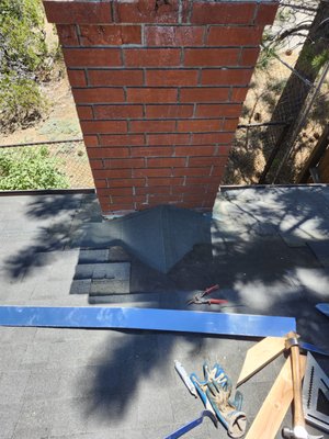 Roof Repair - Installed cricket behind fire place due to leak