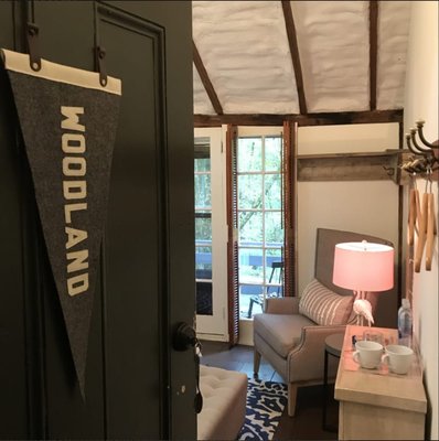 Woodland Roon - On the second floor of the Coach House, Woodland features a queen size poster bed, barn loft ceiling, APOTHEKE amenities, large private in room bath with whirlpool tub and shower combo. Enjoy wooded views from your room and private balcony which overlooks the stream and waterfall.