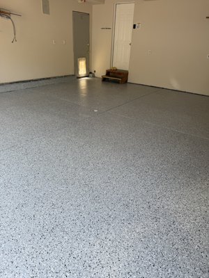 Garage Epoxy Flake - This garage floor had major cracking and was in desperate need of restoration and patching before we could even think about coating it. The customer chose our "California Grey" flake color. And paired with our polyaspartic clear top coat, which is not only durable for years to come but also UV stable, so no need to worry about yellowing. Also polyaspartics UV stable properties makes this system compatible for exterior coatings as well Garage Epoxy Flake - This garage floor had major cracking and was in desperate need of restoration and patching before we could even think about coating it. The customer chose our "California Grey" flake color. And paired with our polyaspartic clear top coat, which is not only durable for years to come but also UV stable, so no need to worry about yellowing. Also polyaspartics UV stable properties makes this system compatible for exterior coatings as well