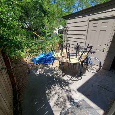 Backyard Patio Cleanup - This was part of a small property clean out. The weeds had overgrown, a thorn tree was growing up under the fence, and a fair amount of stuff was left to the elements. While I was only hired to remove the items, I took a little extra time to clear the weeds and take down the intrusive thorn tree. This went from unruly to very manageable in just a quick call.