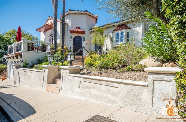 Stucco Retaining Wall With Custom Caps - Silver Lake - The DiBara Team took an existing retaining wall and completely retro-fitted it, adding new custom precast concrete caps, bump out features for detail, and stucco across the face of the wall too. You can't see it, but the team waterproofed the back side of the wall to prevent irrigation from leaking through the wall and causing staining / deterioration while they were at it! Stucco Retaining Wall With Custom Caps - Silver Lake - The DiBara Team took an existing retaining wall and completely retro-fitted it, adding new custom precast concrete caps, bump out features for detail, and stucco across the face of the wall too. You can't see it, but the team waterproofed the back side of the wall to prevent irrigation from leaking through the wall and causing staining / deterioration while they were at it!