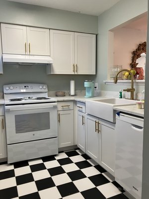 Kitchen remodel - This kitchen remodel was a full replacement of all the cabinets, countertops, sink and a few appliances. We also widened the window from the kitchen to the dining area. We removed the popcorn ceiling texture and painted the walls and ceilings for a fresh look. We also added the checkerboard tile and new trim.