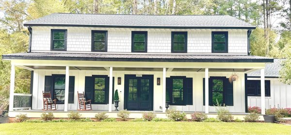 Recent Window Replacement - An old, charming home in Raleigh received a beautiful modern update of replacement windows. The new, black double hung windows make the home pop with the white siding and beautiful flowers. With the beauty, this Raleigh home retains much more temperature control with the UV protection double pane glass. Recent Window Replacement - An old, charming home in Raleigh received a beautiful modern update of replacement windows. The new, black double hung windows make the home pop with the white siding and beautiful flowers. With the beauty, this Raleigh home retains much more temperature control with the UV protection double pane glass.
