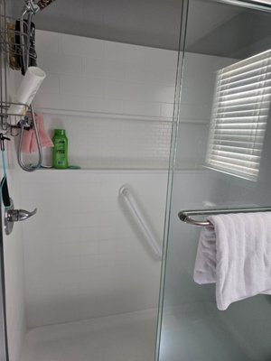 Walk-In Shower Upgrade and Safety Retrofit, Battle Ground WA - Completed a walk-in shower upgrade focused on safety, accessibility, and clean finish detail. This project included updated wall tile, recessed niche storage, new grab bars, and a fold-down shower seat for improved daily use and stability. Final result is a modern, low-maintenance shower space with safer access and a clean look.