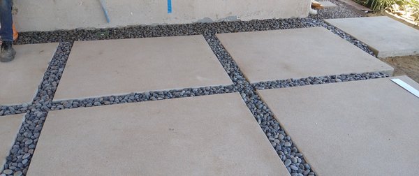 Poured in place concrete pads with deco rock in between - What something a little different than the norm? Take a look at these