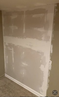 Sanded and painted - This is the before and after newly hung pice of drywall we sanded the mud and painted the wall and a trim.
