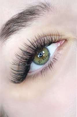 2D Hybrid Mink - This elegant set of 2D hybrid mink lashes combines natural softness with a touch of glam, perfectly enhancing your eyes. The lightweight, fluffy extensions blend seamlessly with your natural lashes, creating a fuller, more voluminous look while maintaining a natural appearance. Perfect for clients seeking a subtle yet sophisticated enhancement, these lashes are designed to last without sacrificing comfort. Give your eyes a captivating allure with the perfect balance of volume and length