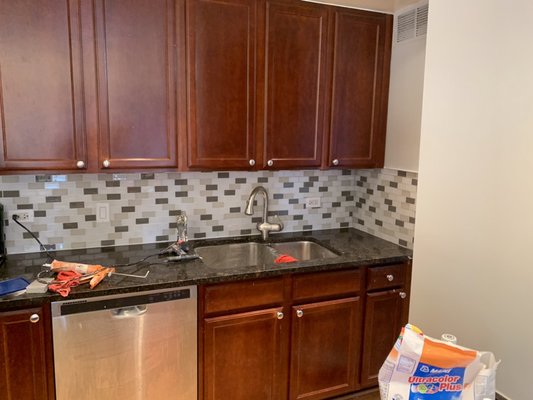 East Huron - This new backsplash was part of a total refurbish of the apartment. Repainted all walls. Regrouted bathtub surround. Removed sliding glass shower door. East Huron - This new backsplash was part of a total refurbish of the apartment. Repainted all walls. Regrouted bathtub surround. Removed sliding glass shower door.
