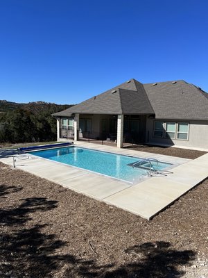 Pool with Automatic Pool Cover - This new construction is a 18’ by 35’ outdoor pool, it has handy cap access, an 8ft deep end and an automatic pool cover that opens and closes at a press of a button.