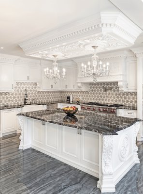 Hand carved white painted kitchen - Utilizing the white painted cabinetry to modernize the traditionally inspired style of the kitchen. Maintaining a constant level of detail and quality through all of the kitchen elements, even extending to the one of a kind coffered ceiling the brings the entire space together. Hand carved white painted kitchen - Utilizing the white painted cabinetry to modernize the traditionally inspired style of the kitchen. Maintaining a constant level of detail and quality through all of the kitchen elements, even extending to the one of a kind coffered ceiling the brings the entire space together.