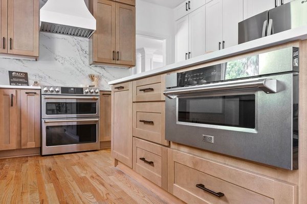 Wood combined with white cabinetry - Step into a beautifully remodeled kitchen where warmth meets modern elegance, expertly crafted by KDO Kitchens and Remodel. This space balances classic white cabinetry with the rich, inviting tones of natural wood, creating a timeless look that feels both cozy and sophisticated.
The white cabinets bring a clean, bright aesthetic, opening up the space and providing a fresh canvas that highlights the beauty of the wood details. The wood cabinetry and accents add texture and warmth, grounding the room and giving it an organic, earthy vibe. Thoughtful storage solutions maximize functionality, while sleek hardware and minimalist design elements keep the look streamlined and modern.
With its harmonious blend of wood and white, this kitchen remodel by KDO Kitchens and Remodel offers a perfect balance of form and function, creating a welcoming, stylish space that’s built to last. Wood combined with white cabinetry - Step into a beautifully remodeled kitchen where warmth meets modern elegance, expertly crafted by KDO Kitchens and Remodel. This space balances classic white cabinetry with the rich, inviting tones of natural wood, creating a timeless look that feels both cozy and sophisticated.
The white cabinets bring a clean, bright aesthetic, opening up the space and providing a fresh canvas that highlights the beauty of the wood details. The wood cabinetry and accents add texture and warmth, grounding the room and giving it an organic, earthy vibe. Thoughtful storage solutions maximize functionality, while sleek hardware and minimalist design elements keep the look streamlined and modern.
With its harmonious blend of wood and white, this kitchen remodel by KDO Kitchens and Remodel offers a perfect balance of form and function, creating a welcoming, stylish space that’s built to last.