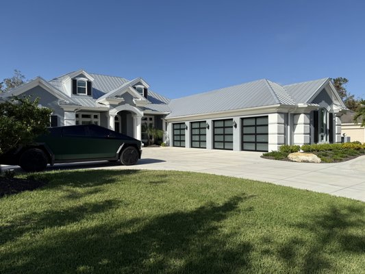 Steel Panel Doors Replaced with Full-View Frosted Glass - We replaced old black short-panel steel garage doors with modern full-view aluminum doors featuring frosted glass. The upgrade completely transformed the exterior, adding a sleek, contemporary look while allowing soft natural light into the garage. The frosted glass offers both brightness and privacy, and the clean aluminum frames give a high-end finish from every angle.

A perfect blend of style and function — this upgrade adds serious curb appeal and everyday comfort.