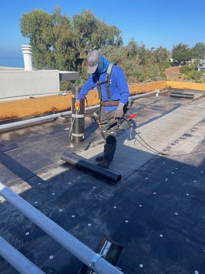 Flat roof - This is a home that needed a new roof. The roof was a rolled asphalt (flat roof) application. We installed a 3 layer application for added waterproofing. Flat roof - This is a home that needed a new roof. The roof was a rolled asphalt (flat roof) application. We installed a 3 layer application for added waterproofing.