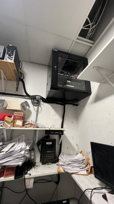 Organization for wiring was in the wall on the floor and put it in one place ￼ - We realized the wires was in this room. It was horrible. There is more than hundred wire on the floor and all of them connected too many kind of routers in the switch. This is gas station. I don’t know how that was work but after eight hours we get the job done with a few wires, and we put rack on the wall inside easy to make any kind of maintenance