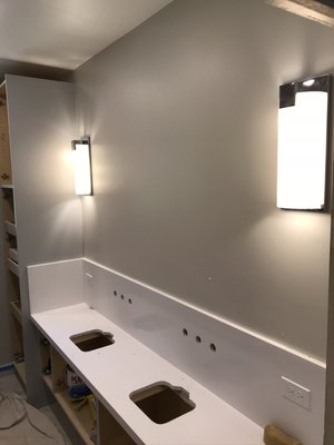 bathroom remodle - The carefully chosen lighting fixtures not only illuminate the space brilliantly but also add a touch of elegance and modernity. The well-thought-out placement of lights enhances the architectural features of the room, creating a visually stunning and inviting atmosphere.