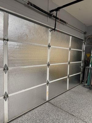 3-Car Garage Door Insulation – Peoria, AZ - This Peoria garage was baking in the summer heat until we installed radiant barrier insulation panels on all three garage doors. This simple but highly effective upgrade helps reflect heat away from the garage, keeping it significantly cooler and more energy efficient. The panels are clean, secure, and installed flush for a polished finish. Ideal for anyone using their garage as a workspace, gym, or storage space. 3-Car Garage Door Insulation – Peoria, AZ - This Peoria garage was baking in the summer heat until we installed radiant barrier insulation panels on all three garage doors. This simple but highly effective upgrade helps reflect heat away from the garage, keeping it significantly cooler and more energy efficient. The panels are clean, secure, and installed flush for a polished finish. Ideal for anyone using their garage as a workspace, gym, or storage space.