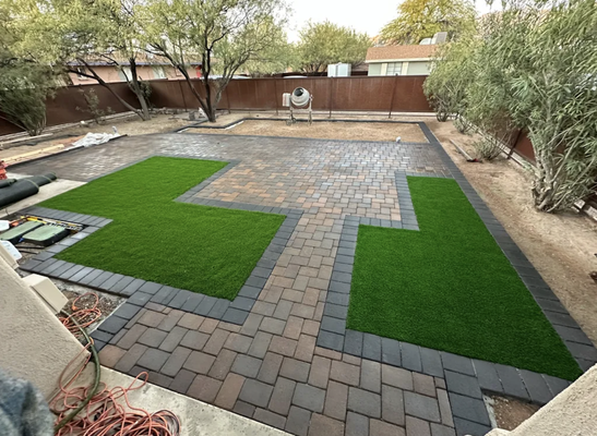 Turf, Pavers, Gravel, & Stepping Stones in Tucson AZ - Paver patio , artificial turf installed . As well as stepping stones and a beautiful curved walkway , plants , irrigation system , gravel. Went from having plain dirt to a beautiful carefully designed and executed install with attention to detail! Turf, Pavers, Gravel, & Stepping Stones in Tucson AZ - Paver patio , artificial turf installed . As well as stepping stones and a beautiful curved walkway , plants , irrigation system , gravel. Went from having plain dirt to a beautiful carefully designed and executed install with attention to detail!